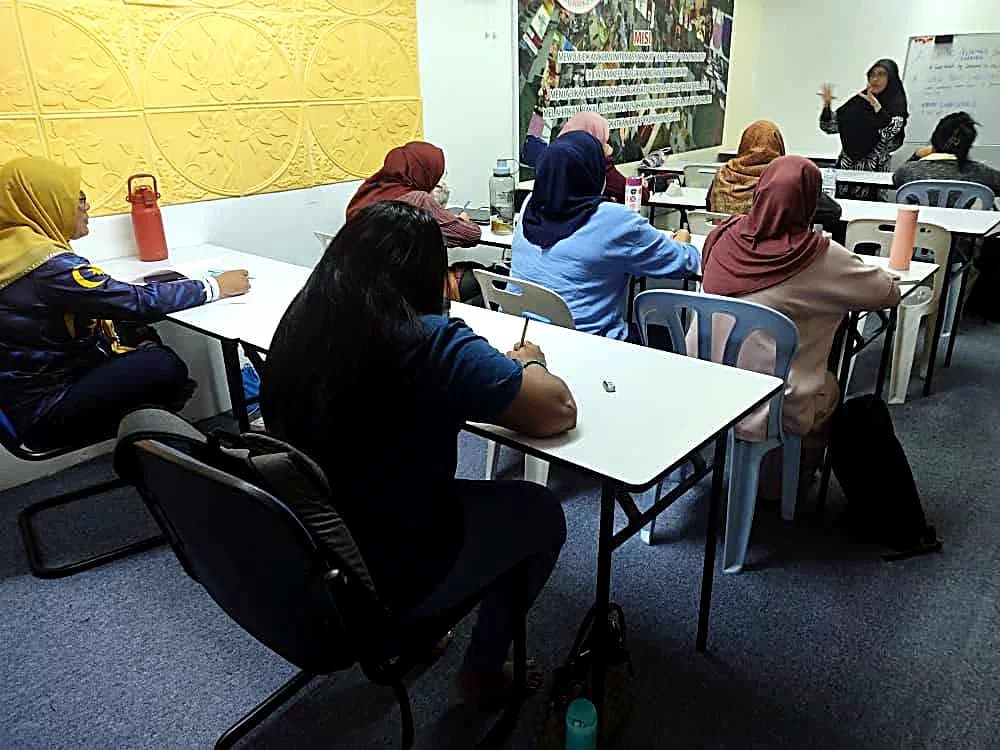 Students taking notes during a classroom session