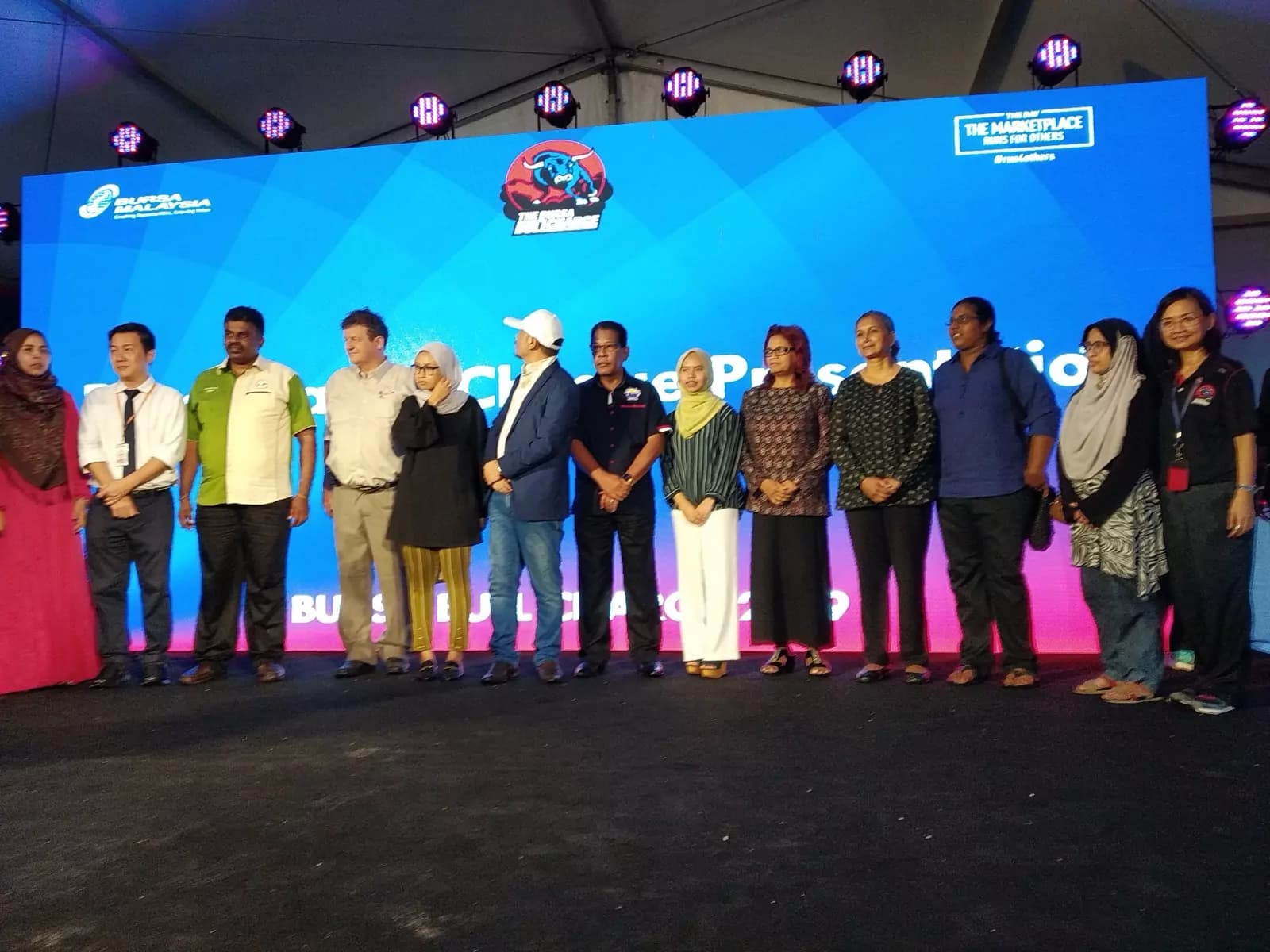 The academy team on stage with partners at an industry event